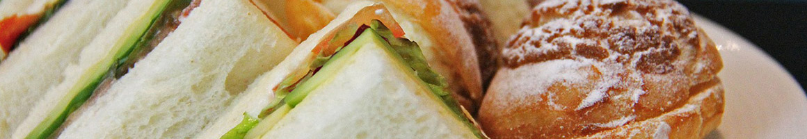 Eating Deli Sandwich at The Brick Your Neighborhood Deli restaurant in Pomona, CA.